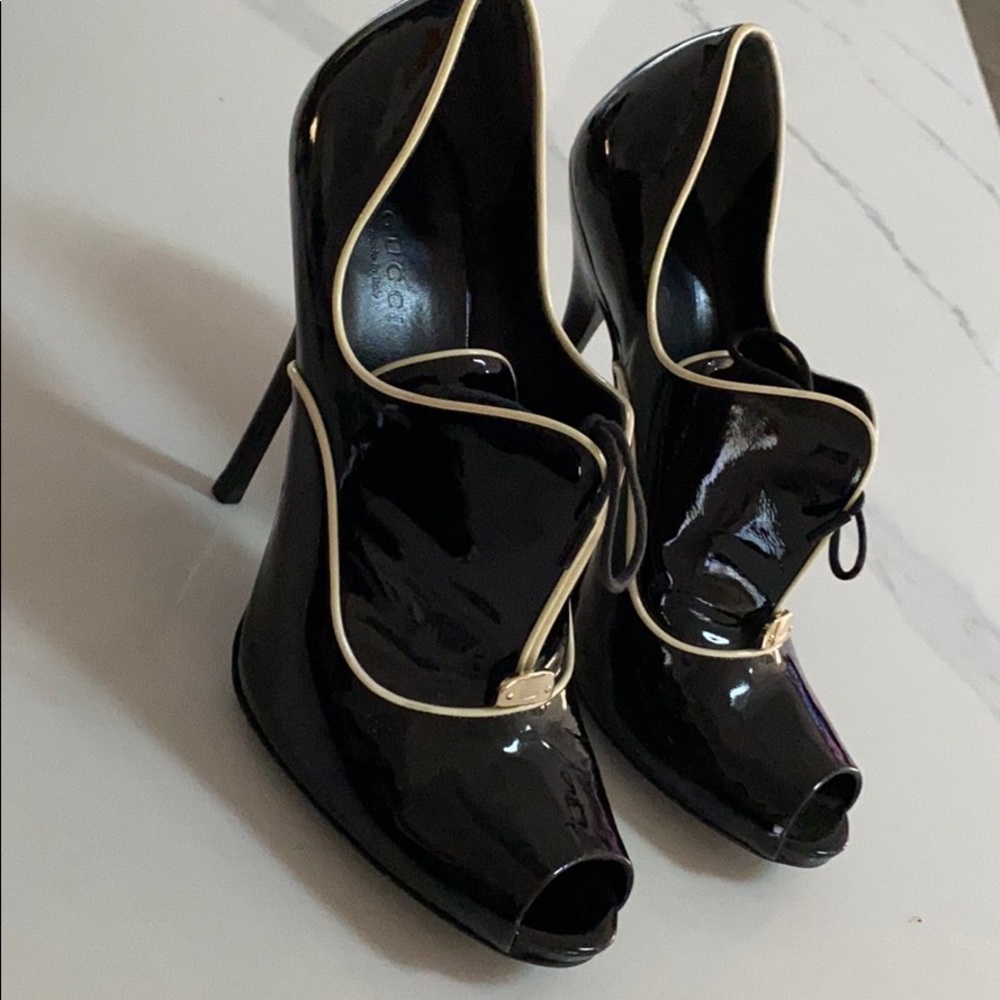 Gucci
Black Lace-up Patent Leather Booties